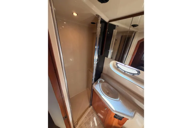 Slide: The Image of 2005 Cruisers Yachts 405 Express Motoryacht bathroom with shower and sink. - 84