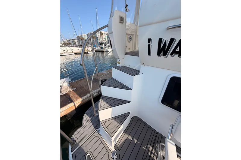 Slide: The Image of Staircase on 2005 Cruisers Yachts 405 Express Motoryacht, docked at marina. - 13