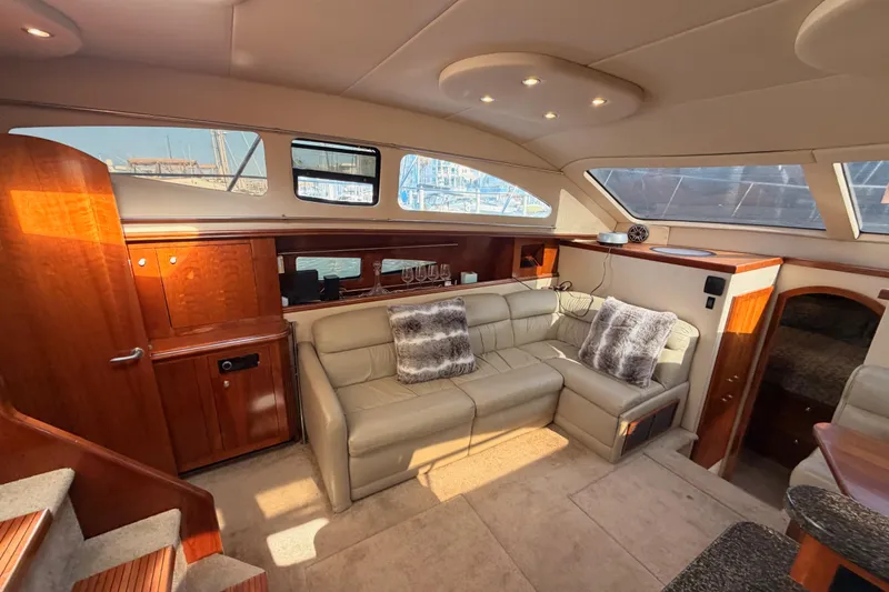 Slide: The Image of Luxurious interior of 2005 Cruisers Yachts 405 Express Motoryacht with plush seating and elegant wood finishes. - 48