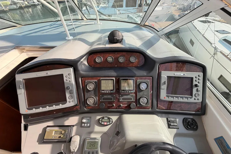 Slide: The Image of Dashboard of a 2005 Cruisers Yachts 405 Express Motoryacht with navigation equipment. - 35