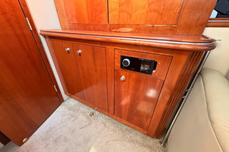 Slide: The Image of 2005 Cruisers Yachts 405 Express Motoryacht interior with wooden cabinetry and stereo system. - 72