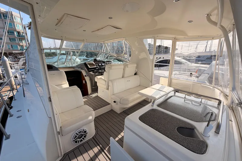Slide: The Image of 2005 Cruisers Yachts 405 Express Motoryacht interior with seating and helm station. - 16