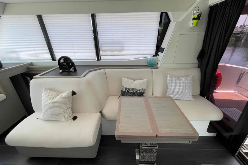 Slide: The Image of Interior of 2022 Fountaine Pajot MY4.S yacht with modern seating and table. - 9