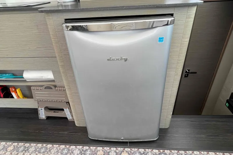 Slide: The Image of Compact silver Danby refrigerator in a modern kitchen on a 2022 Fountaine Pajot MY4.S yacht. - 14