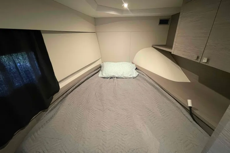 Slide: The Image of Cozy bedroom interior of 2022 Fountaine Pajot MY4.S yacht with modern design elements. - 26