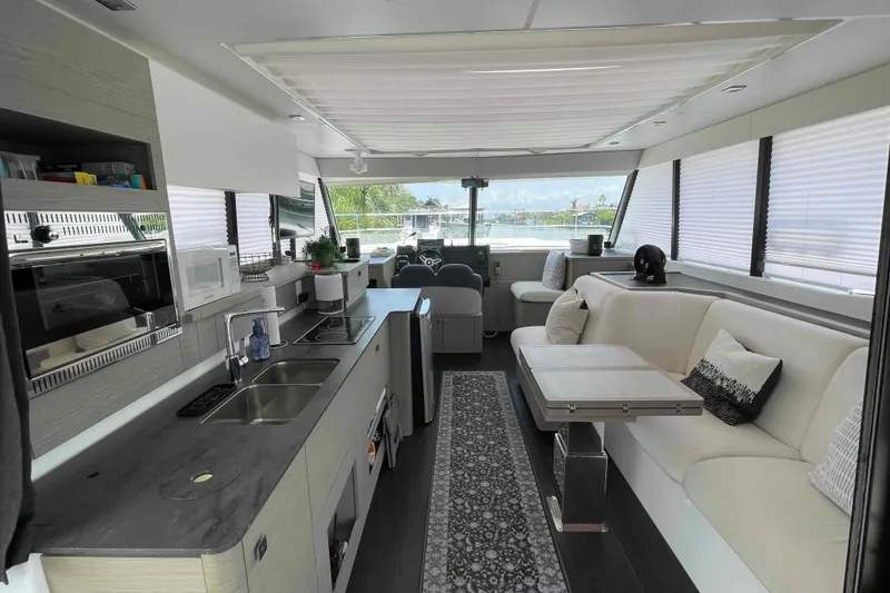 Slide: The Image of Luxurious interior of 2022 Fountaine Pajot MY4.S yacht with modern kitchen and seating area. - 7