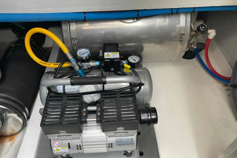 Slide: The Image of Engine room of 2022 Fountaine Pajot MY4.S with mechanical components and gauges. - 60