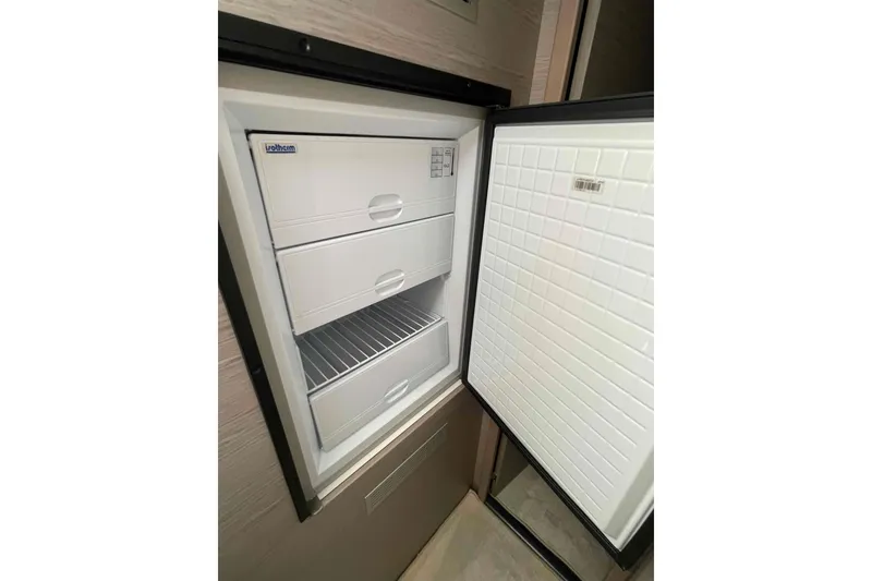 Slide: The Image of Open freezer with three drawers inside a 2022 Fountaine Pajot MY4.S yacht. - 34