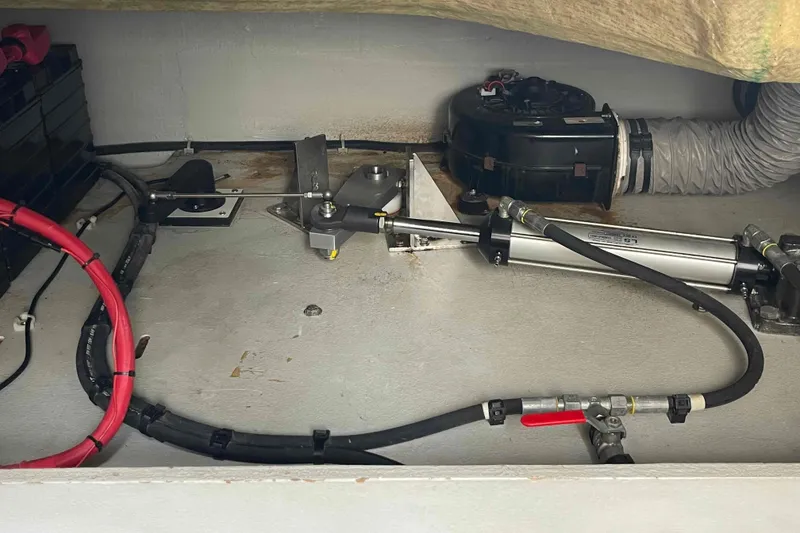 Slide: The Image of Engine compartment of 2022 Fountaine Pajot MY4.S with hydraulic and electrical components. - 59
