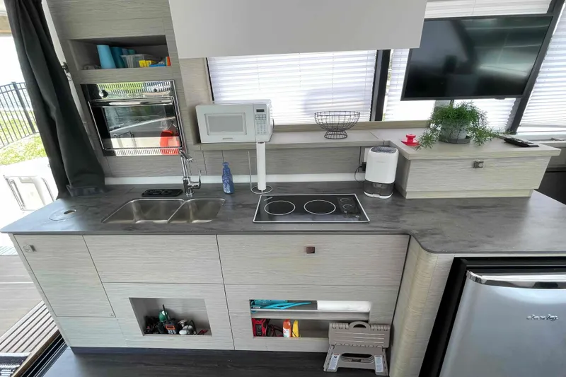 Slide: The Image of Modern kitchen in 2022 Fountaine Pajot MY4.S yacht with sleek appliances and stylish design. - 8