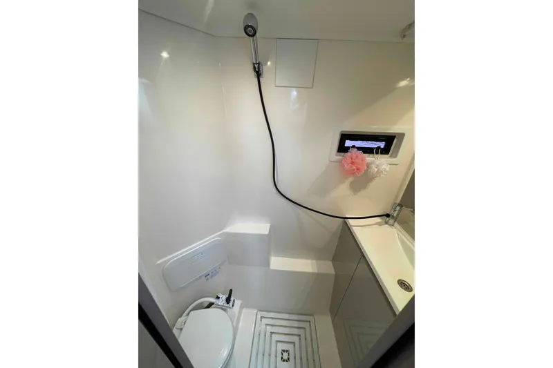 Slide: The Image of Modern bathroom in 2022 Fountaine Pajot MY4.S yacht, featuring shower and toilet. - 31