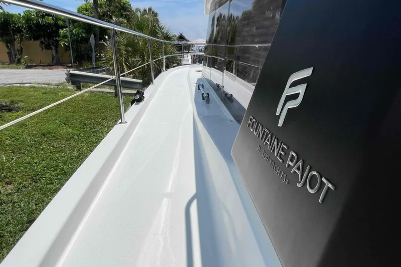 Slide: The Image of 2022 Fountaine Pajot MY4.S yacht deck with logo, showcasing sleek design and craftsmanship. - 16