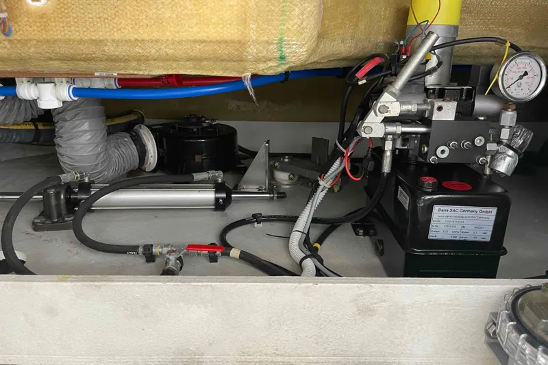 Slide: The Image of Engine room of 2022 Fountaine Pajot MY4.S with hydraulic and mechanical components. - 64