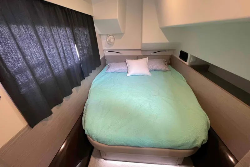 Slide: The Image of Cozy bedroom in 2022 Fountaine Pajot MY4.S yacht with teal bedding and dark curtains. - 32
