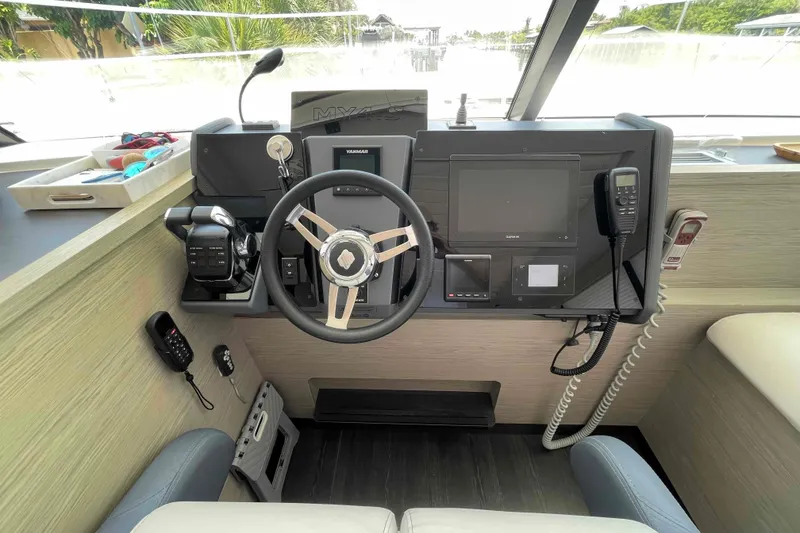 Slide: The Image of Helm of 2022 Fountaine Pajot MY4.S yacht with modern navigation equipment and controls. - 41