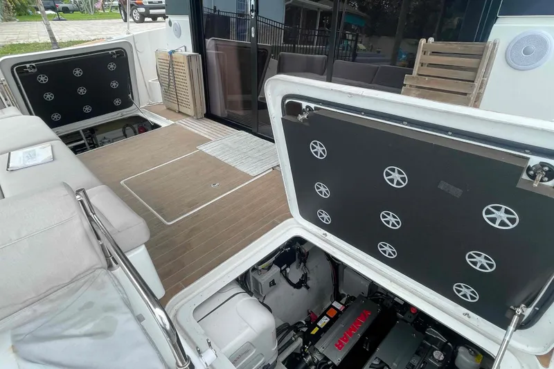 Slide: The Image of 2022 Fountaine Pajot MY4.S yacht interior with open engine compartments and seating area. - 49