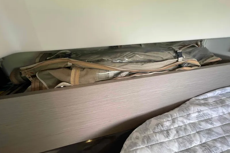 Slide: The Image of Storage compartment in 2022 Fountaine Pajot MY4.S yacht with neatly packed items. - 22