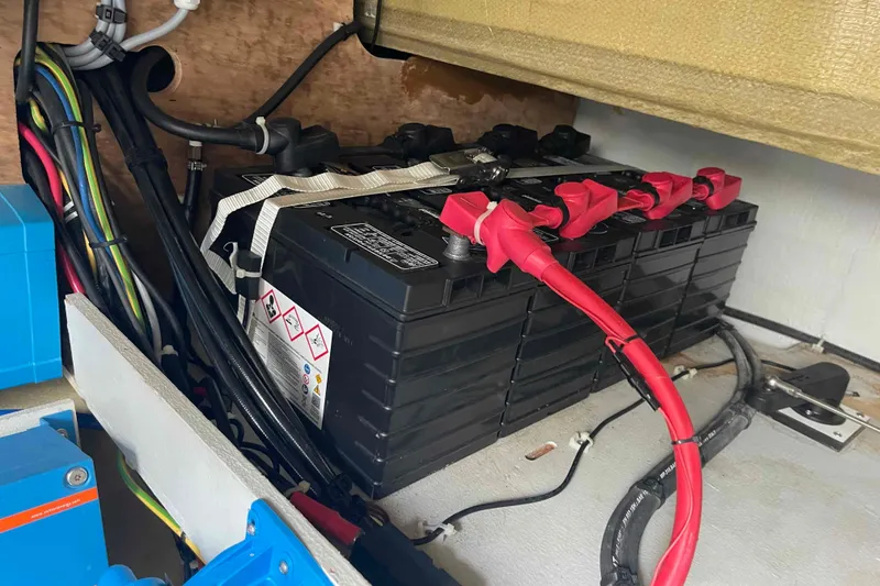 Slide: The Image of Battery compartment of 2022 Fountaine Pajot MY4.S with cables and connections. - 54