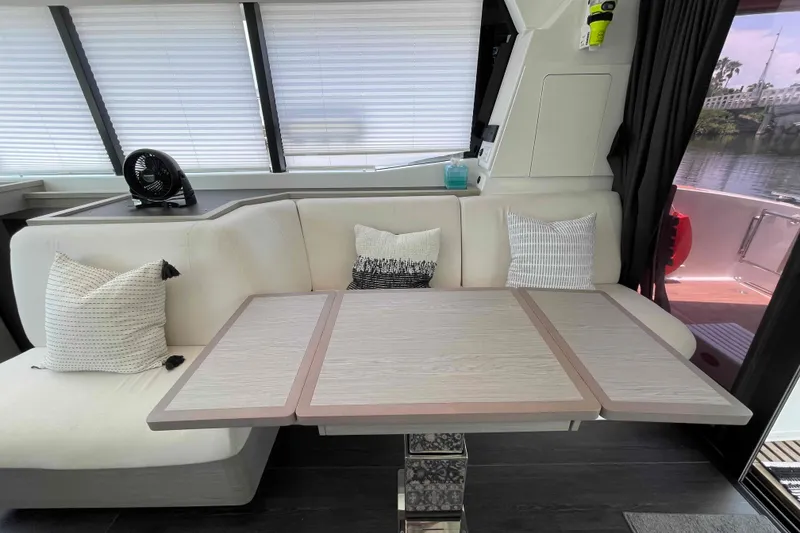 Slide: The Image of Interior of 2022 Fountaine Pajot MY4.S yacht with modern seating and table. - 10