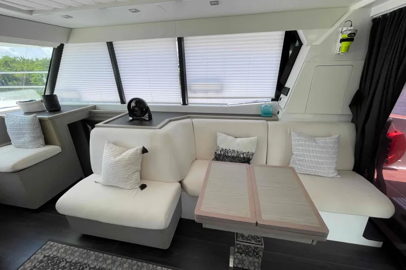 Slide: The Image of Luxurious interior of 2022 Fountaine Pajot MY4.S yacht with modern seating and decor. - 29
