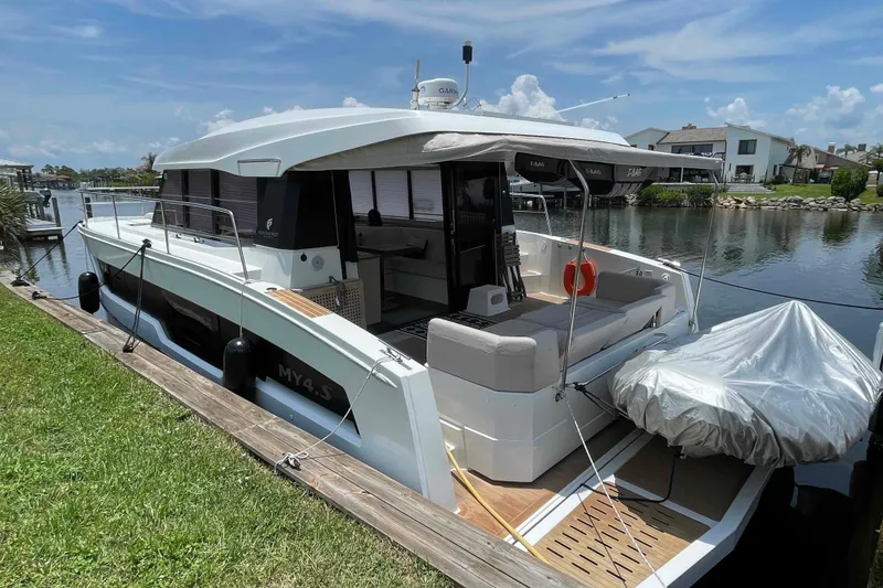 Slide: The Image of 2022 Fountaine Pajot MY4.S yacht docked by a serene waterfront. - 45