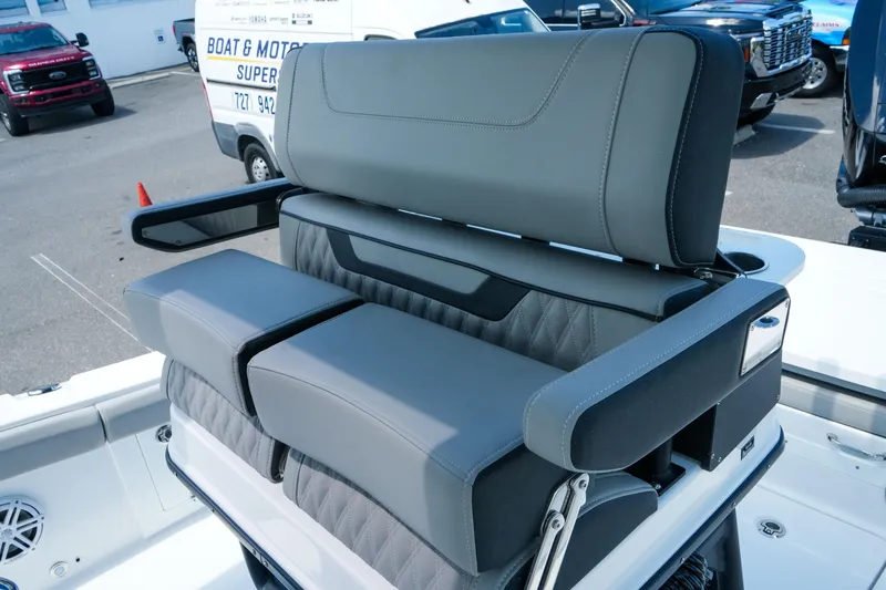 Slide: The Image of 2026 Blackfin 262 HB boat seating with sleek gray upholstery and armrests. - 34