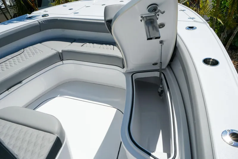 Slide: The Image of 2026 Blackfin 262 HB boat interior with open storage compartment and cushioned seating. - 26