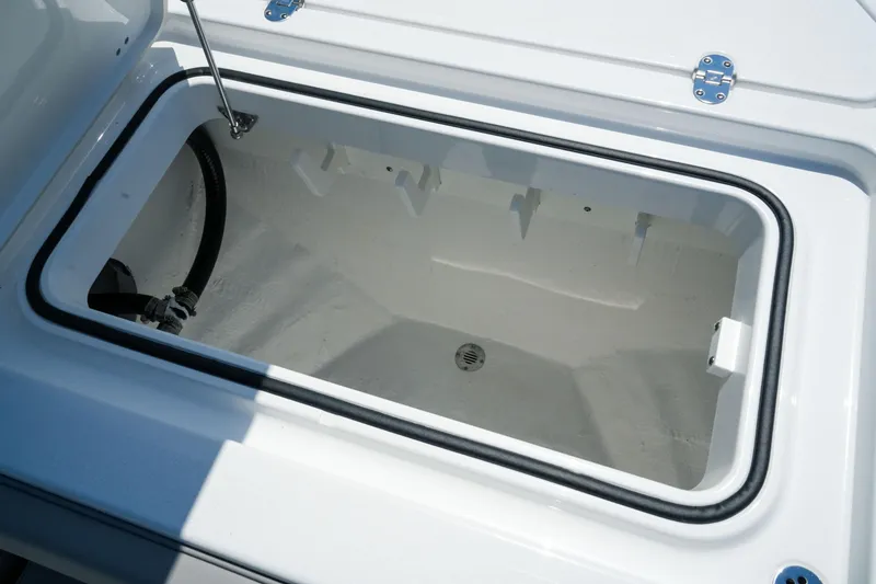 Slide: The Image of Open storage compartment on 2026 Blackfin 262 HB boat, featuring a clean, white interior. - 28