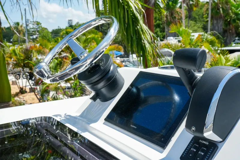 Slide: The Image of Helm of 2026 Blackfin 262 HB boat with steering wheel and control panel. - 25