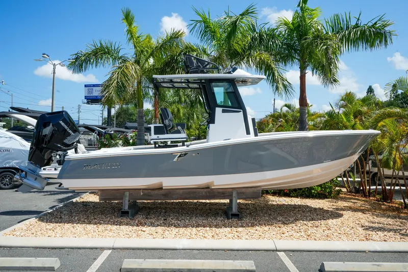 The Image of 2026 Blackfin 262 HB boat displayed outdoors with palm trees in the background. - 1