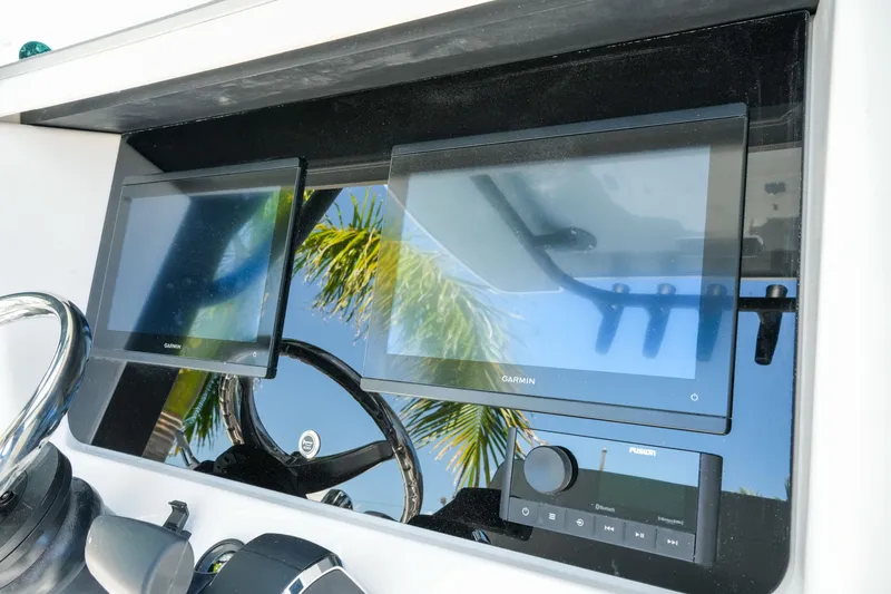 Slide: The Image of Dashboard of 2026 Blackfin 262 HB boat with Garmin displays and Fusion audio system. - 16