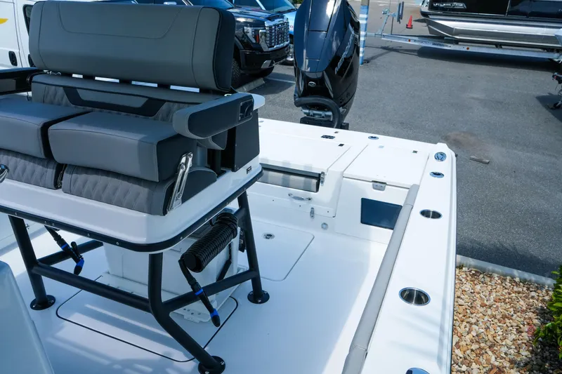 Slide: The Image of 2026 Blackfin 262 HB boat interior with seating and motor, displayed outdoors. - 33