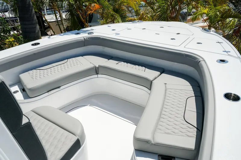 Slide: The Image of Luxurious seating area on 2026 Blackfin 262 HB boat, featuring elegant gray cushions. - 18