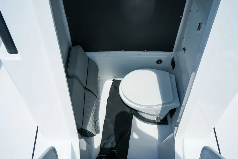 Slide: The Image of 2026 Blackfin 262 HB boat interior with compact marine toilet. - 31