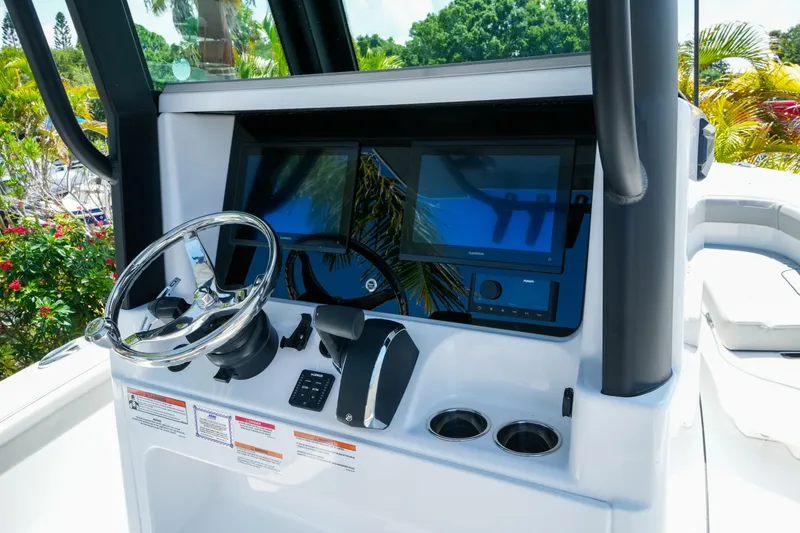 Slide: The Image of Helm of 2026 Blackfin 262 HB boat with modern controls and dual displays. - 14