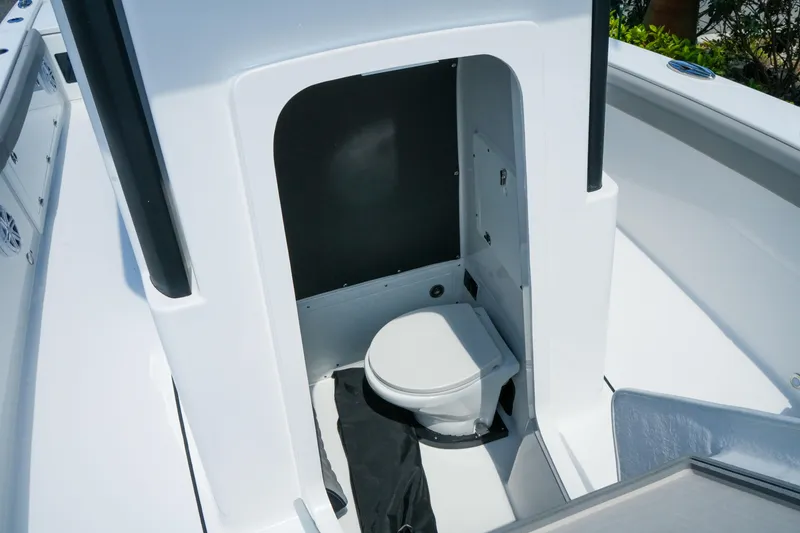 Slide: The Image of 2026 Blackfin 262 HB boat interior with compact marine toilet. - 30