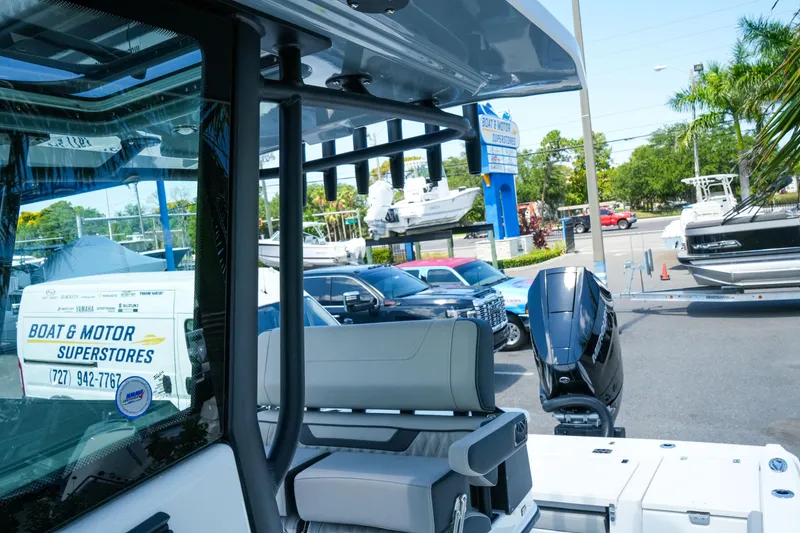 Slide: The Image of 2026 Blackfin 262 HB boat at dealership with motor and seating visible. - 32