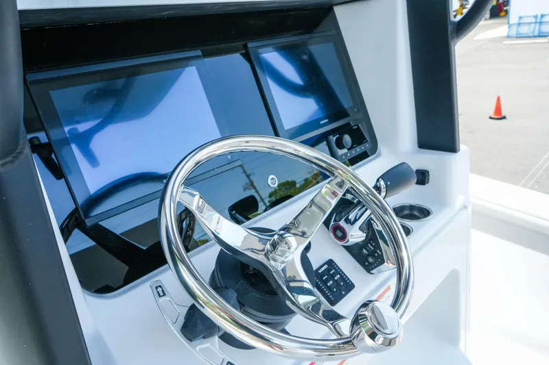 Slide: The Image of Steering console of 2026 Blackfin 262 HB boat with dual screens and controls. - 35