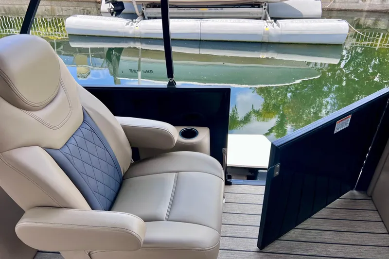 Slide: The Image of Luxurious seating on 2021 Starcraft SLS 3 boat, featuring elegant design and water view. - 27