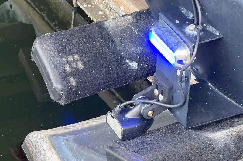 Slide: The Image of Close-up of a 2021 Starcraft SLS 3 boat trailer with blue LED light. - 47
