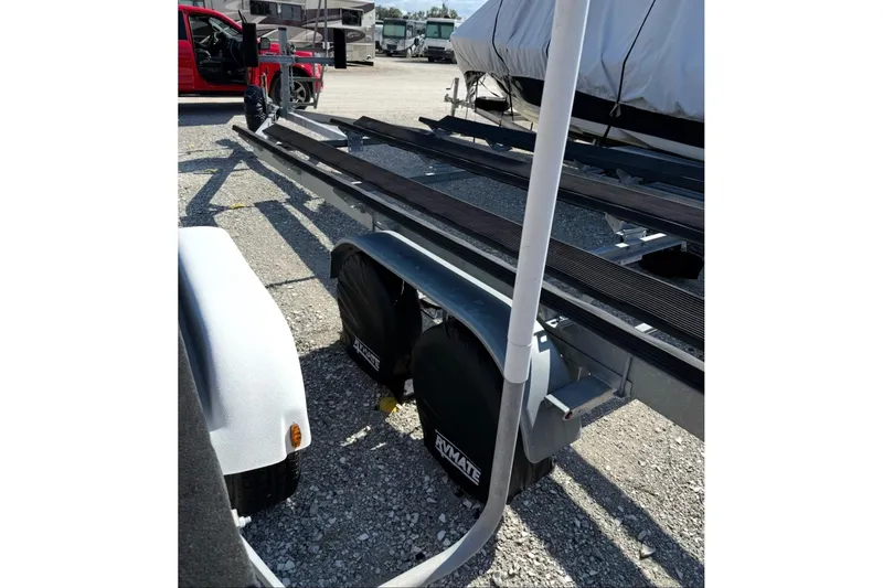 Slide: The Image of Trailer for 2021 Starcraft SLS 3 boat, parked on gravel lot. - 52