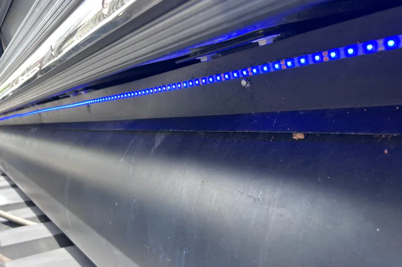 Slide: The Image of 2021 Starcraft SLS 3 boat with blue LED lighting detail. - 7