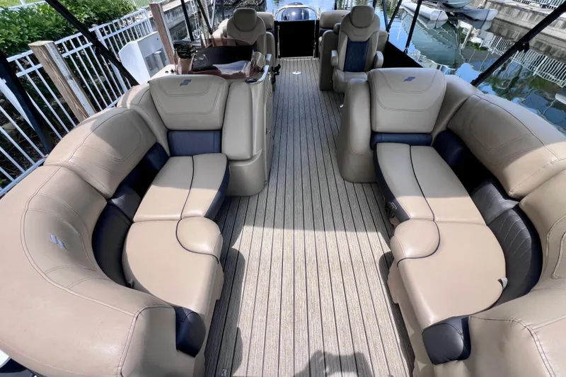 Slide: The Image of Luxurious seating on 2021 Starcraft SLS 3 boat with beige upholstery and spacious layout. - 18