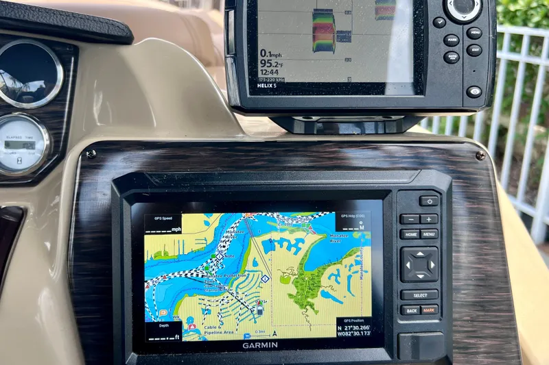 Slide: The Image of Dashboard of a 2021 Starcraft SLS 3 with Garmin navigation system and sonar display. - 38