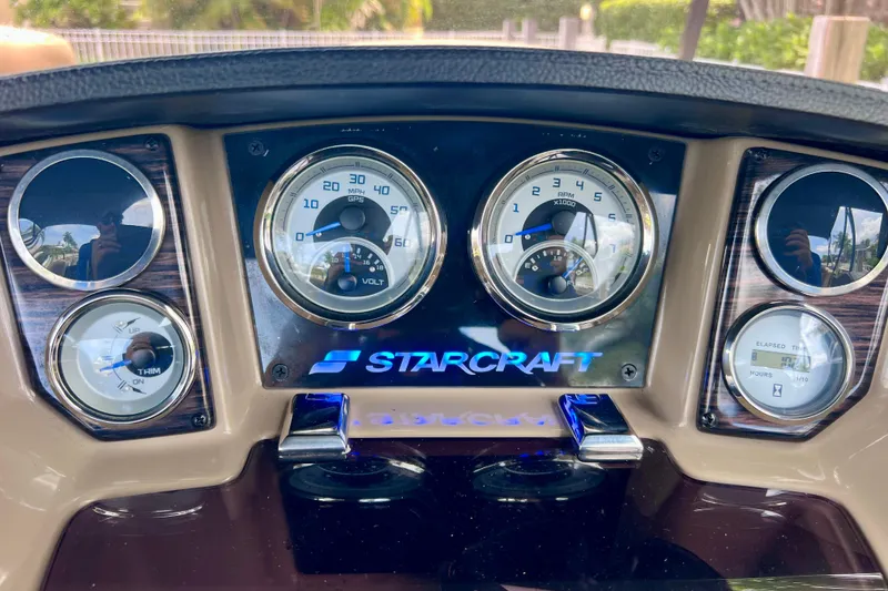 Slide: The Image of Dashboard of 2021 Starcraft SLS 3 boat with gauges and controls. - 35