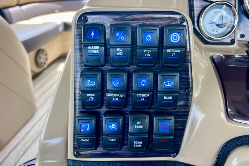 Slide: The Image of Control panel of a 2021 Starcraft SLS 3 boat with labeled switches. - 36