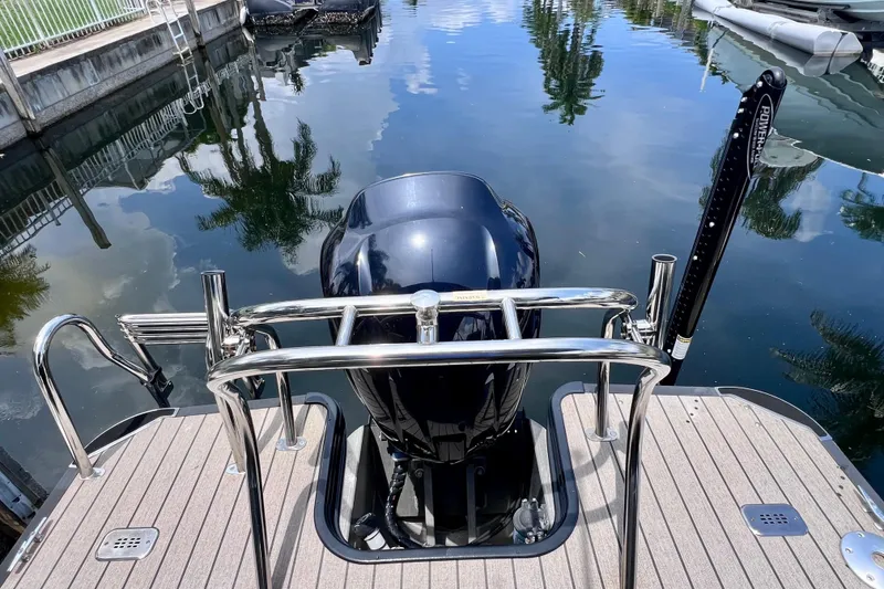 Slide: The Image of 2021 Starcraft SLS 3 boat with outboard motor at dockside. - 15