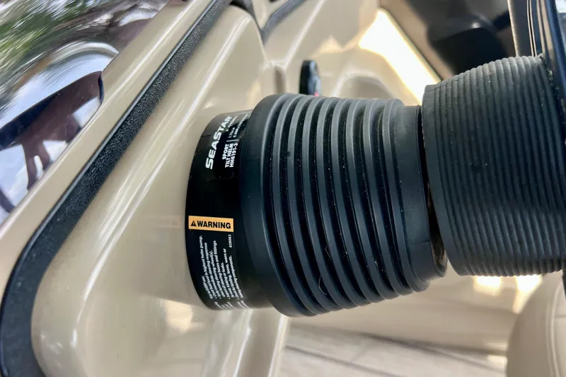 Slide: The Image of Close-up of SeaStar hydraulic steering component on 2021 Starcraft SLS 3 boat. - 41