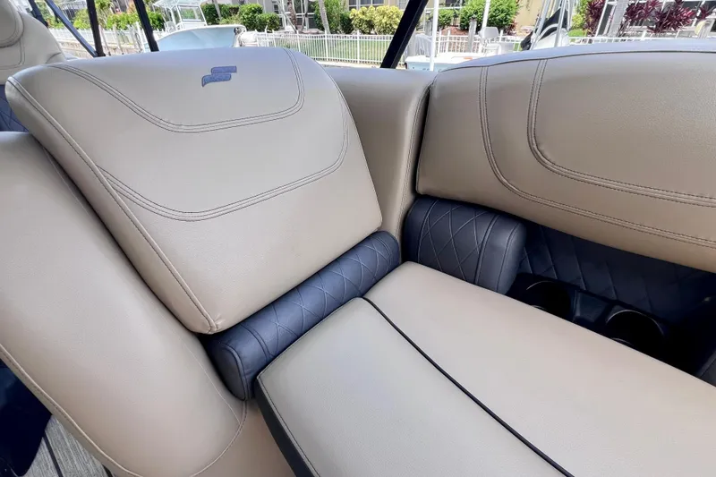 Slide: The Image of Luxurious seating on 2021 Starcraft SLS 3 boat, featuring beige and navy upholstery. - 30