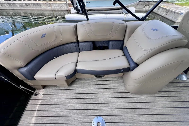 Slide: The Image of Luxurious seating on a 2021 Starcraft SLS 3 boat with beige and gray upholstery. - 20